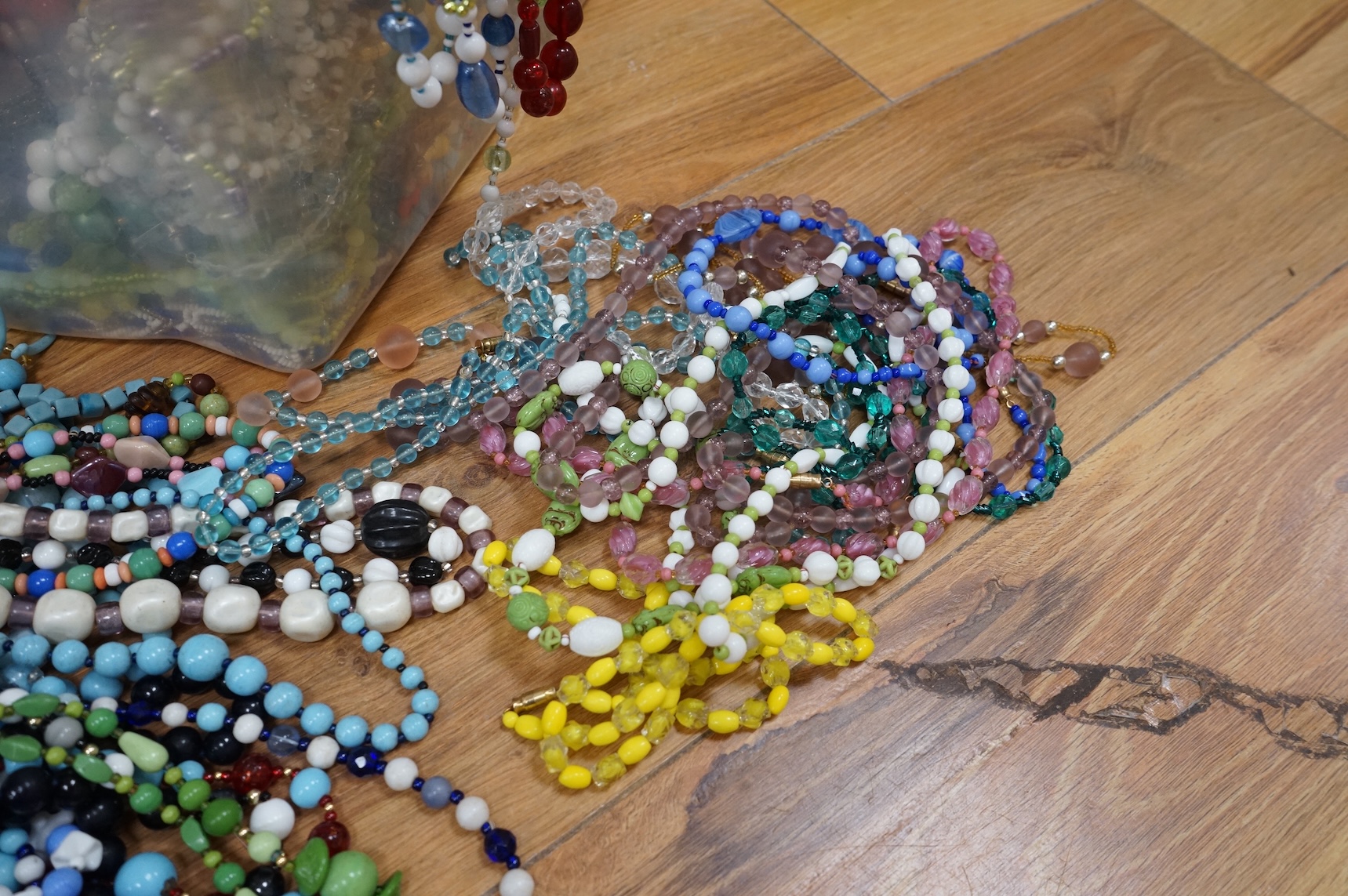 A large collection of glass bead necklaces